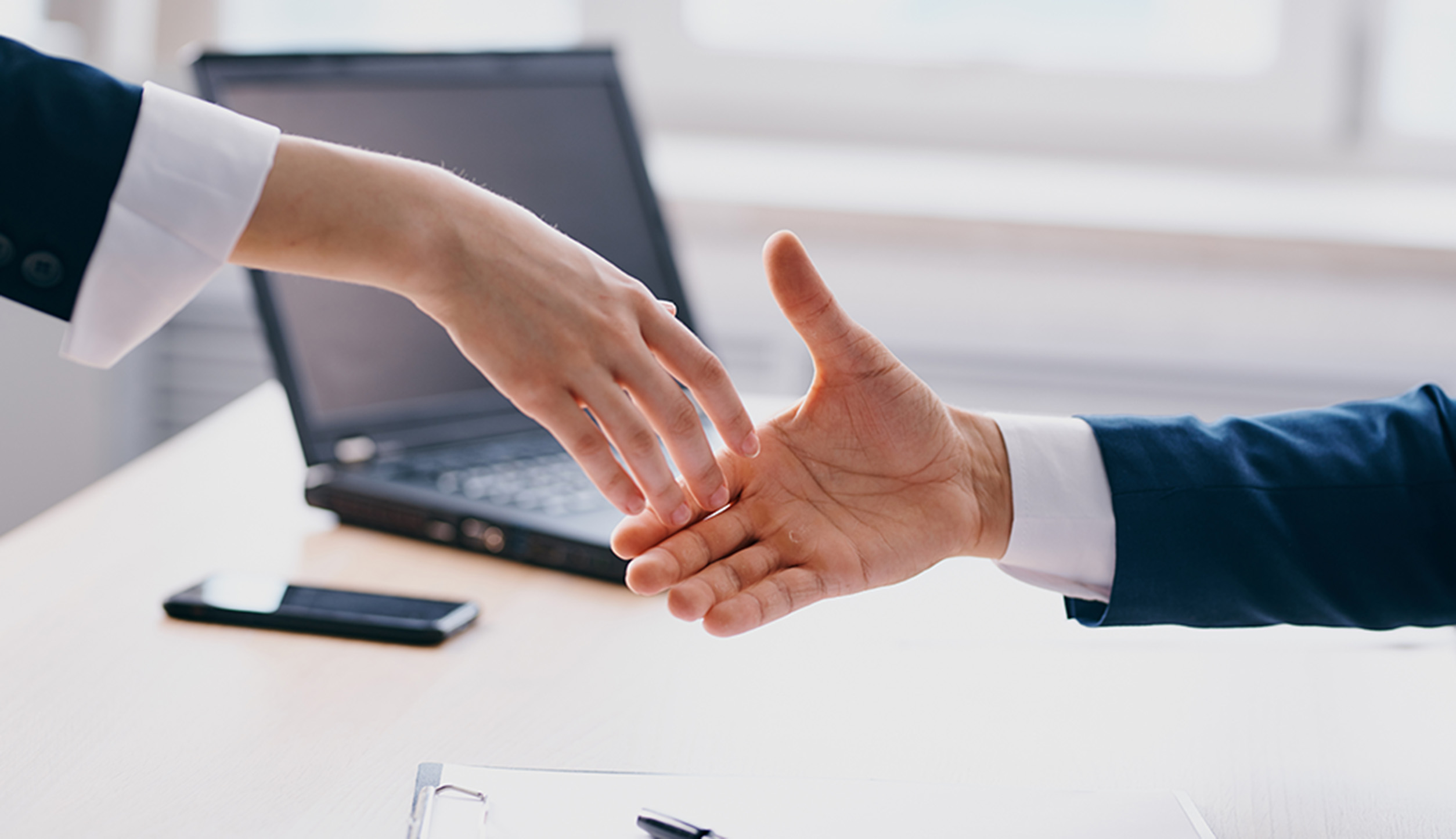 Business people shake hands at work In the office.